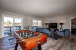 Downstairs family room with fooseball table and HDTV